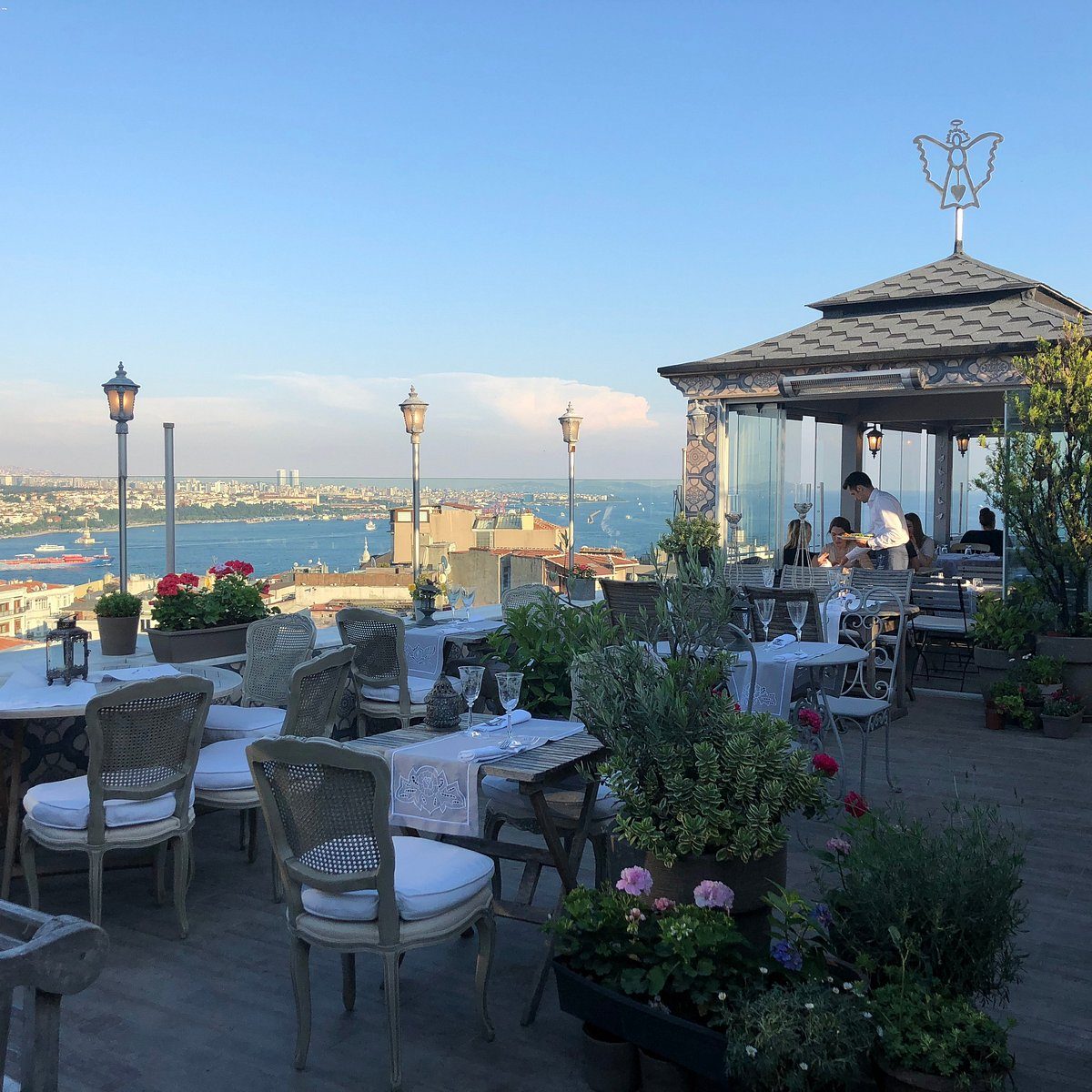 The Bosphorus-to-Topkapı rooftop view from 5. Kat restaurant at dusk